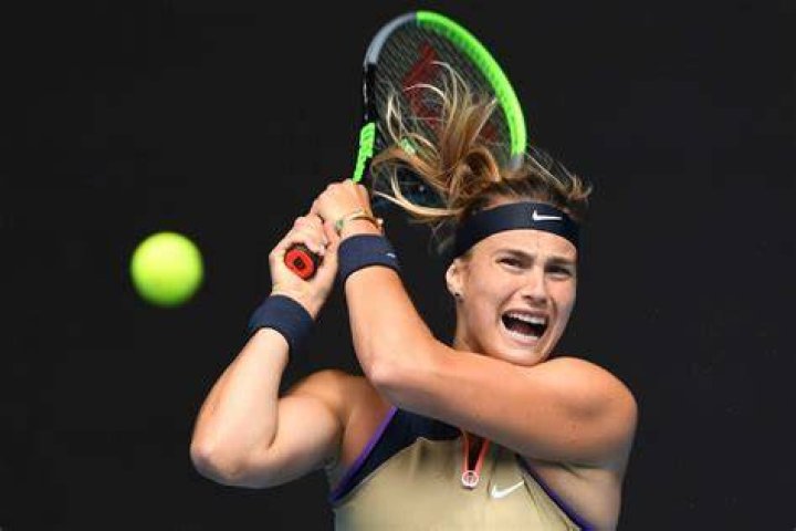 Aryna Sabalenka screams as she hits the ball